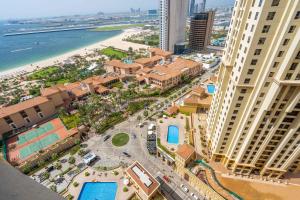 an aerial view of the resort with the beach and buildings at MAJESTIC JBR - SEA VIEW - Jumeirah Beach Residence in Dubai