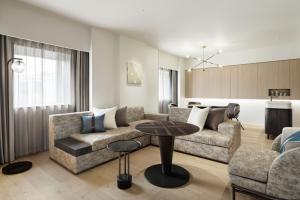 a living room with a couch and a table at Courtyard by Marriott Tokyo Ginza Hotel in Tokyo