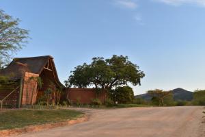 an old barn on the side of a dirt road at Tipperary Game Lodge - Mbombela in Karino