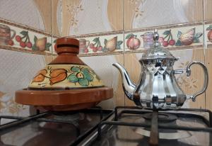 a tea kettle sitting on top of a stove at Traditional apartment in the center of Agadir in Agadir