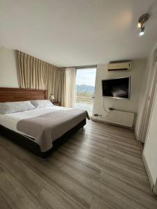 Ein Bett oder Betten in einem Zimmer der Unterkunft Apart Lyon Suite