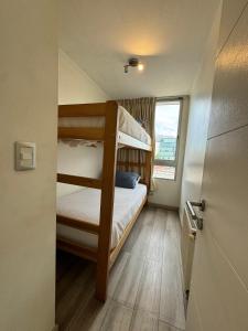 Ein Bett oder Betten in einem Zimmer der Unterkunft Apart Lyon Suite
