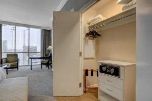 a room with a bed and a kitchen with a table at MGM Studio Suite with POOL VIEW Tower 1 in Las Vegas