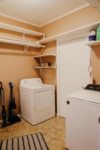 a laundry room with a washer and dryer at Hadley's House - A Country 3 Bdrm with Screened-In Porch in New Braunfels