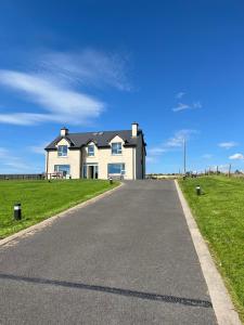 a house on the side of a road at Robins Nest in Ardara