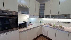 Kuchyň nebo kuchyňský kout v ubytování LilLy HOME 36