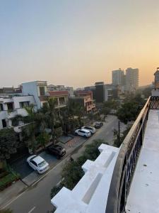 a view of a city with cars parked on a street at Luxury duplex bungalow noida 50 in Noida
