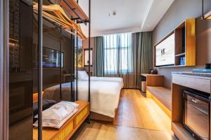 Cama ou camas em um quarto em Qiuguo Hotel - Beijing Chaoyang Branch