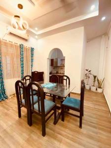 a dining room with a table and chairs at Beautiful Ganga side villa in Rishīkesh