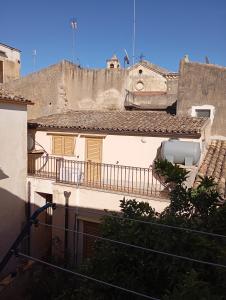 a view of a building with a balcony at Casa Matea in Noto +32 photos