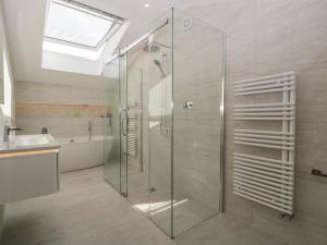 a bathroom with a glass shower and a sink at Hidden Well in Bristol +43 photos