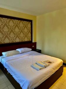 A bed or beds in a room at 978 CHIDLOM at JOMTIEN