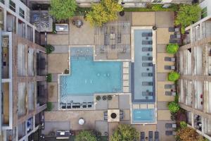 an overhead view of a swimming pool between two buildings at U2 penthouse Downtown Houston WI-FI/free parking in Houston