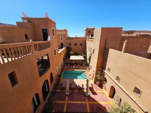 an aerial view of a building with a swimming pool at Kasbah La Cigogne in Aït Benhaddou