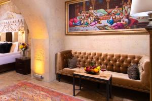 A bed or beds in a room at Cappadocia Pegasos Cave Suite Hotel
