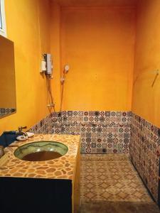 a bathroom with a sink and a shower at Six Nature Resort in Chiang Rai