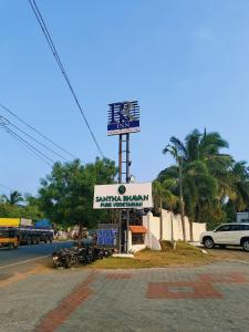 a sign for a restaurant on the side of a street at RR INN Group Of Hotels in Kanyakumari