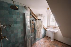 a bathroom with a shower and a sink at Amante in Kuressaare