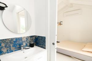 Voodi või voodid majutusasutuse Secret Suite Varigotti toas