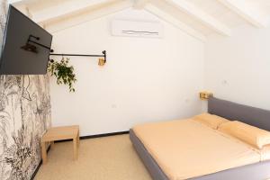 Postel nebo postele na pokoji v ubytování Secret Suite Varigotti