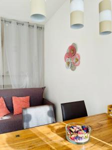 a dining room table with a bowl of food on it at Agriturismo La Selvaggia in Mandello del Lario