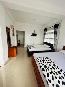 Letto o letti in una camera di Mystik Muthu View Resort