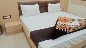 Hotel Grand Inn客房内的一张或多张床位