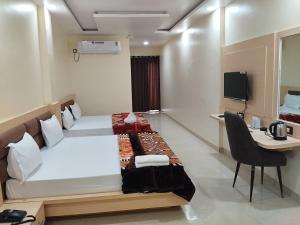 Hotel Grand Inn客房内的一张或多张床位