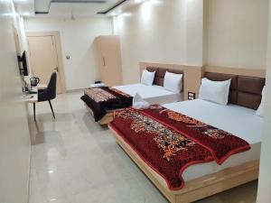 Hotel Grand Inn客房内的一张或多张床位