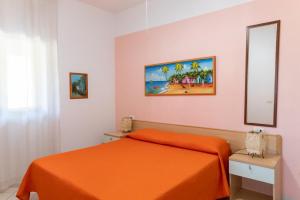 A bed or beds in a room at Villa Marilena