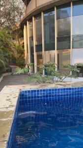The swimming pool at or close to Stylish 3BHK Penthouse W/Terrace Steps from EON IT