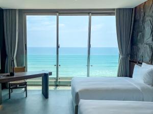 Ένα ή περισσότερα κρεβάτια σε δωμάτιο στο M Hotel Danang