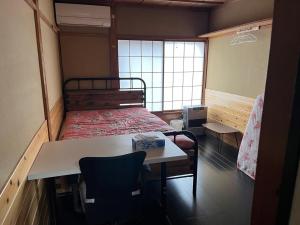 Postel nebo postele na pokoji v ubytování Futago Cabin