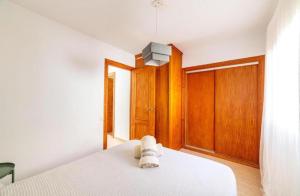 a bedroom with a bed with a stuffed animal on it at Estación Las Negras in Las Negras