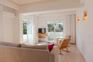 a living room with a couch and a table at Kalkan Suites 202 in Kalkan