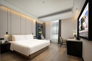 Postel nebo postele na pokoji v ubytování Atour Hotel Fuzhou Yongjia Tiandi