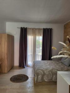 Postel nebo postele na pokoji v ubytování Cielo Studio & Apartments