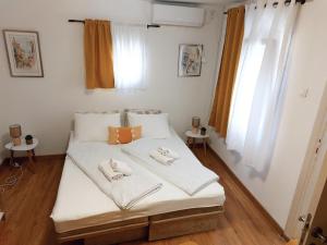 Postel nebo postele na pokoji v ubytování Ljubovic apartman