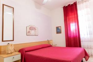 A bed or beds in a room at Villa Marilena