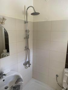 a bathroom with a shower and a sink at Villa Sylvia 1 Matala in Matala