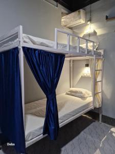 Postel nebo postele na pokoji v ubytování Faith Dorms