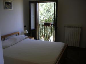 Tempat tidur dalam kamar di Agriturismo Torre Rinusa