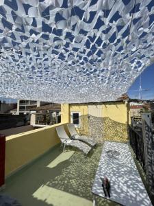En balkon eller terrasse på Triplex avec terrasse en rooftop, au coeur de Sete