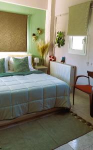 מיטה או מיטות בחדר ב-Amalia's Maisonette