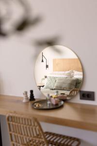 a mirror sitting on top of a desk at Panorama Suites in Kastraki Naxou