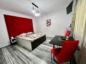 TV a/nebo společenská místnost v ubytování Aigi Rooms Vila + 20 fotografií