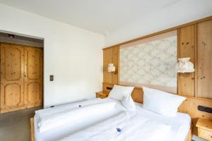 Letto o letti in una camera di Haus Widdersteinblick