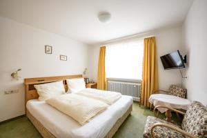Letto o letti in una camera di Haus Widdersteinblick