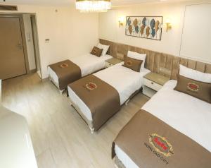 Postel nebo postele na pokoji v ubytování Safa Hotel Old City