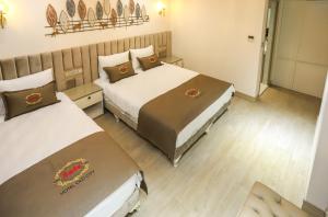 Postel nebo postele na pokoji v ubytování Safa Hotel Old City